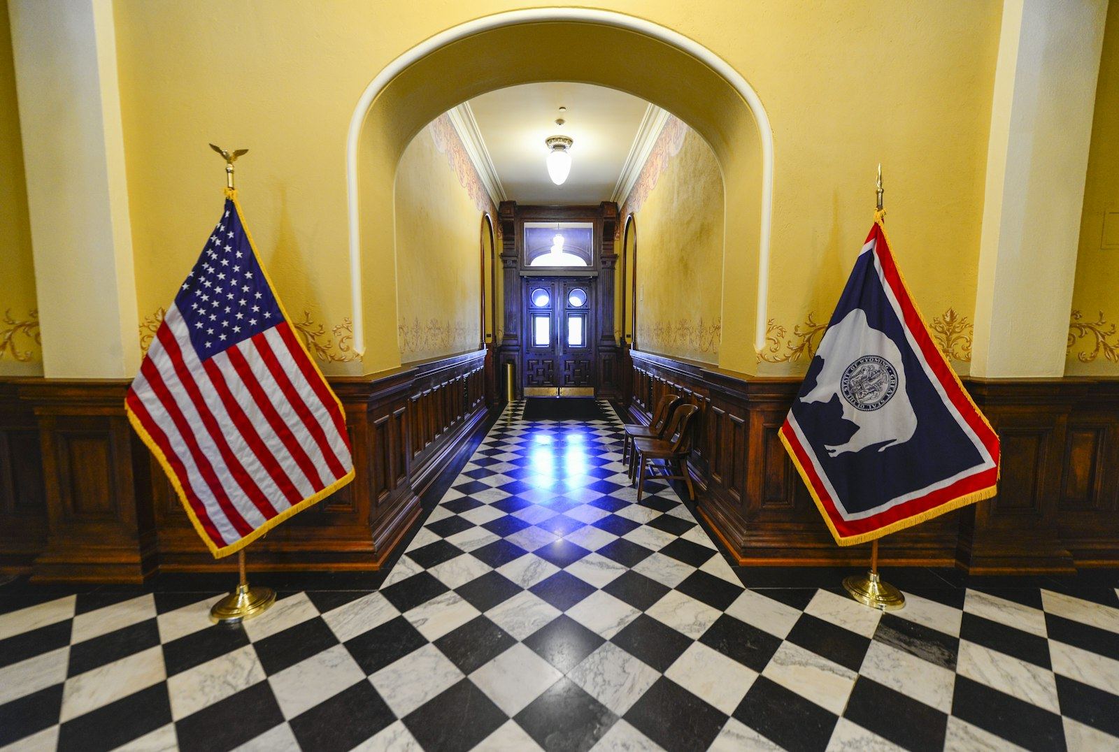 Hallway inside the Wyoming State Capitol with the United States and Wyoming flags